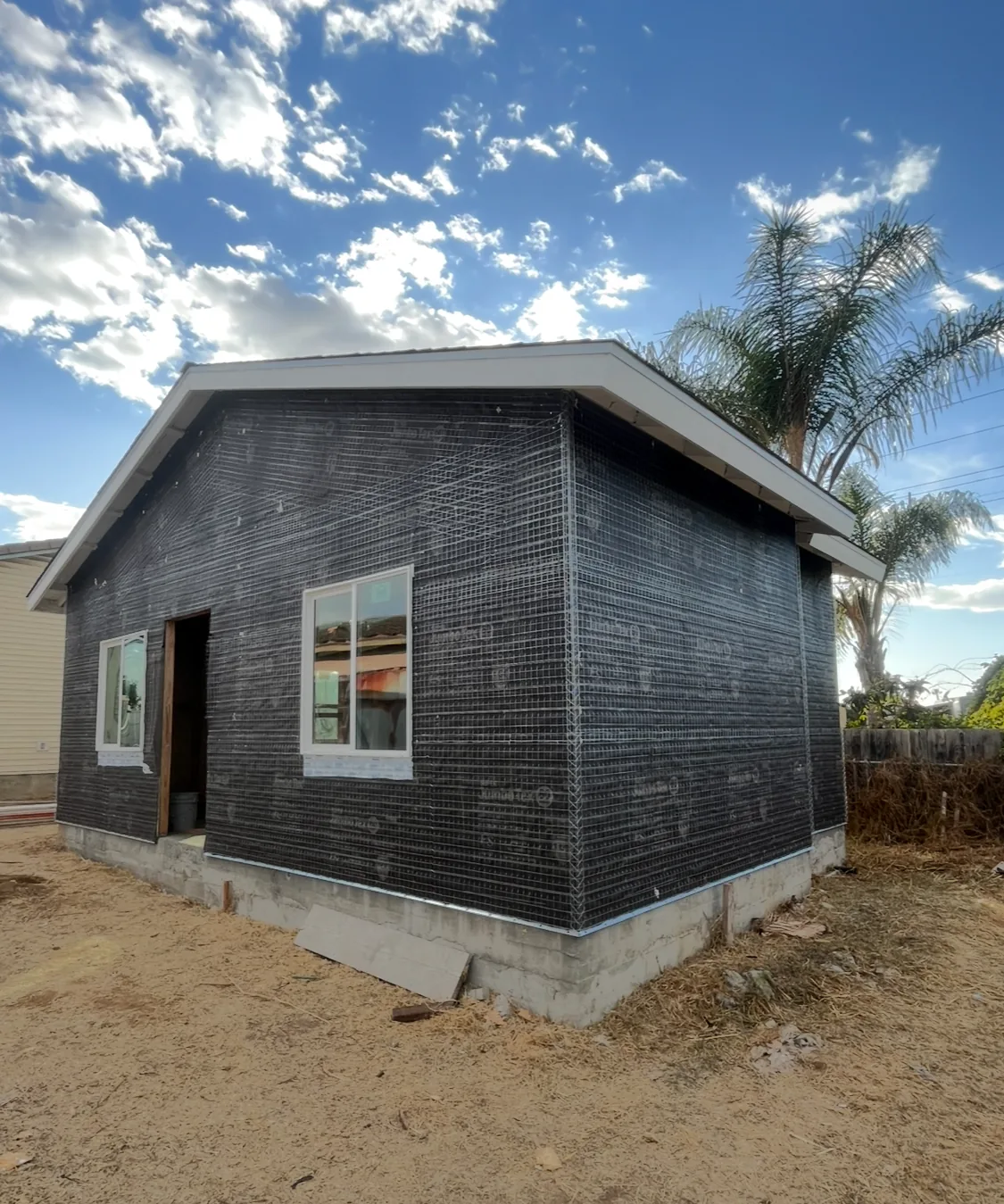 Building exterior during lath installation