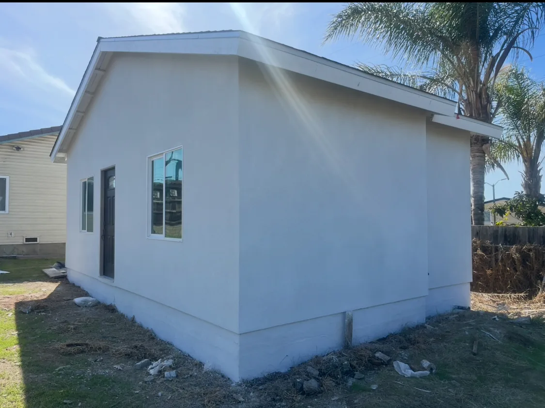 Finished stucco exterior at a building corner