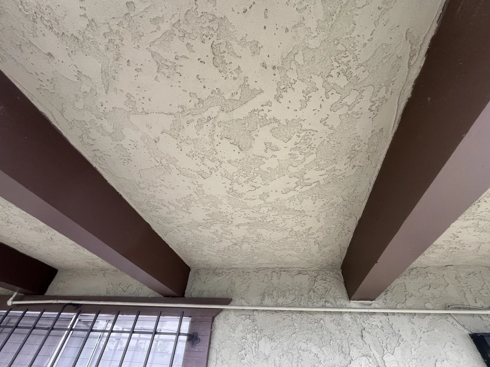 Finished textured underside between exterior beams